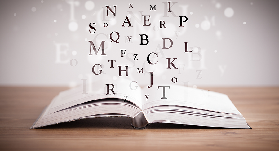 Annotations, Citations, and Quotations Opened book with flying letters